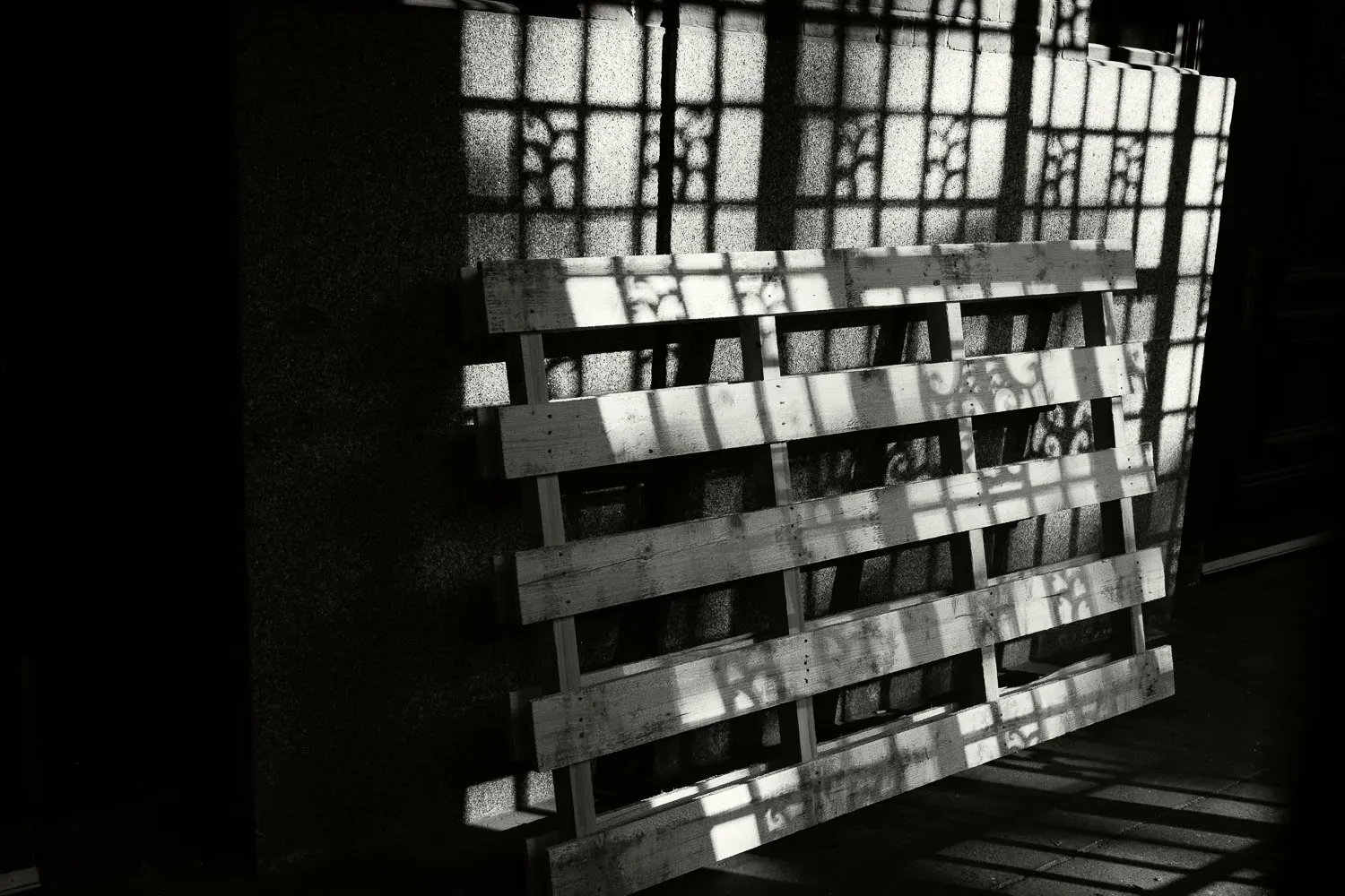 Pallet with railing shadows