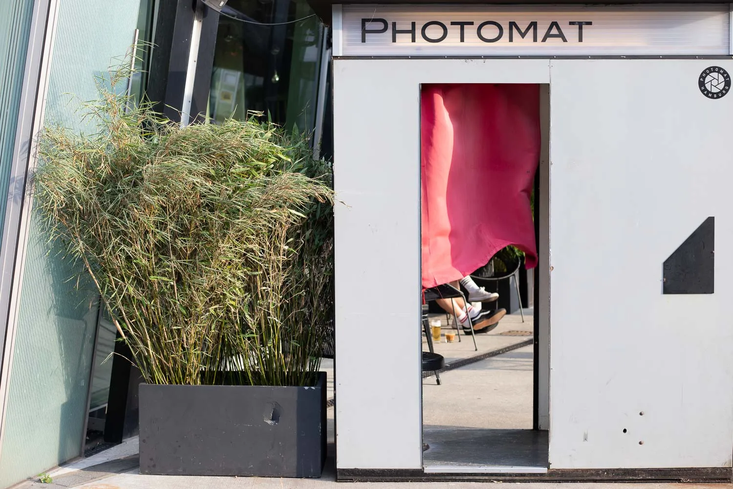 Photo booth with legs seen underneath