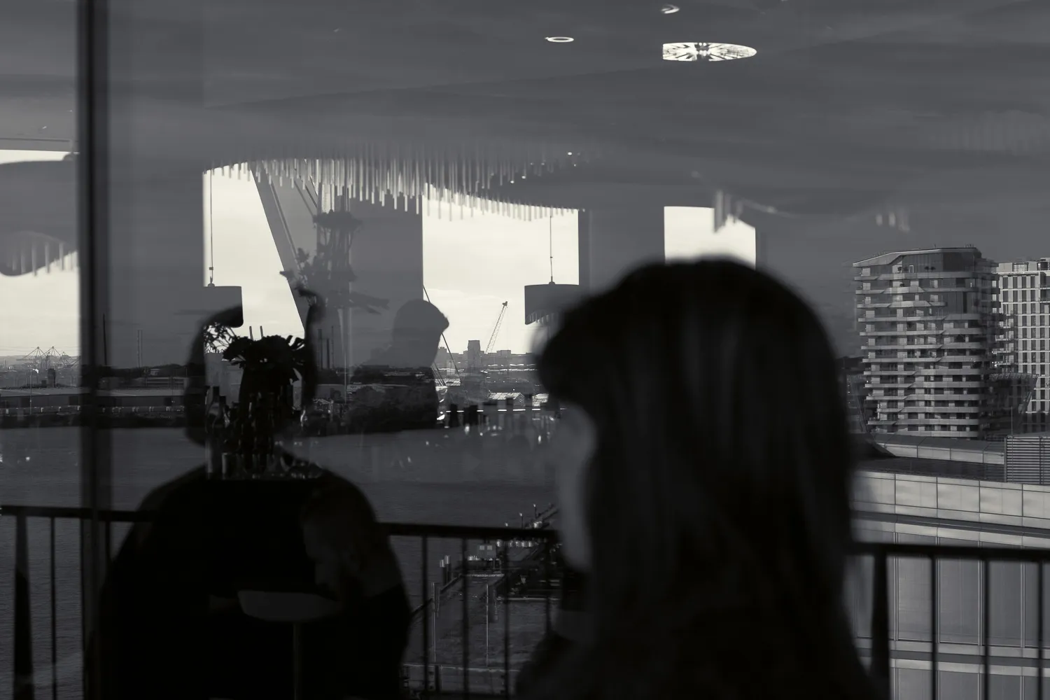 People reflection on glass window